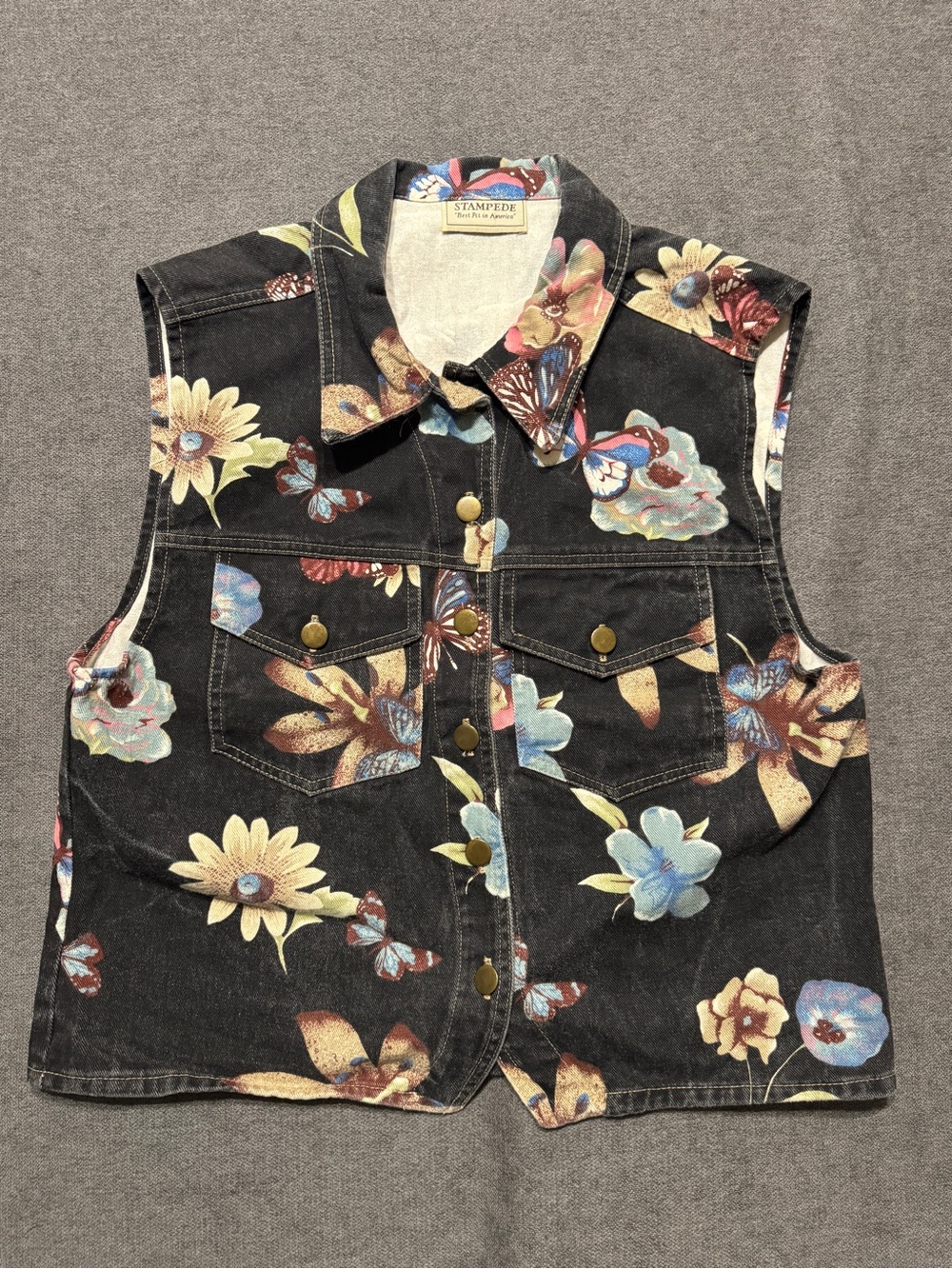 Stampede black denim vest with floral and butterfly pattern